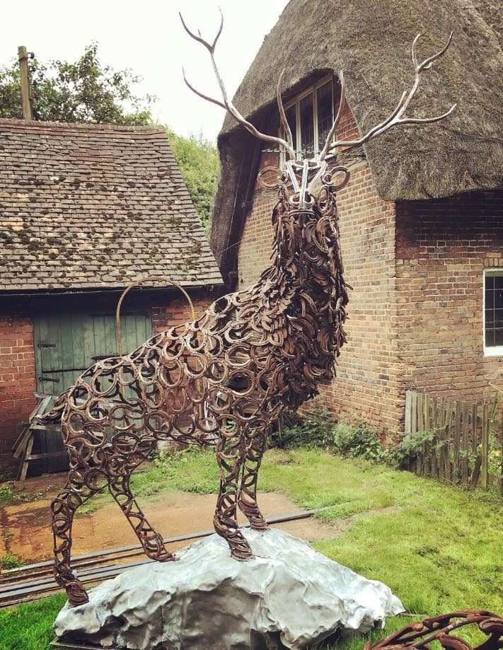 large stag sculpture looking at camera