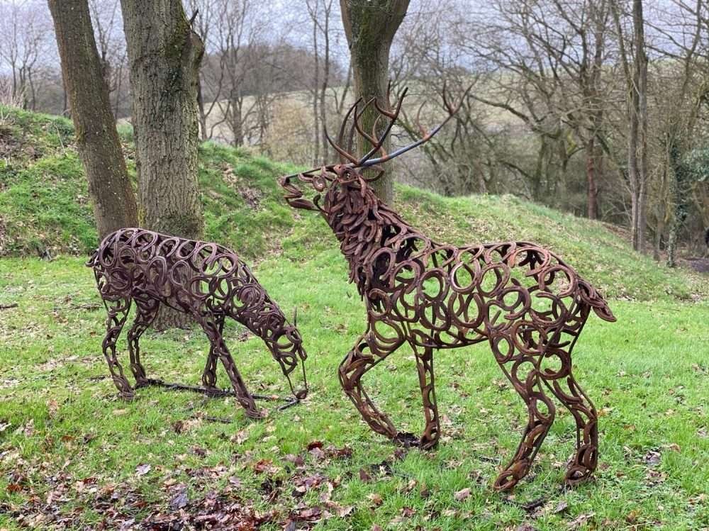 Stag and Doe Sculptures In Woods
