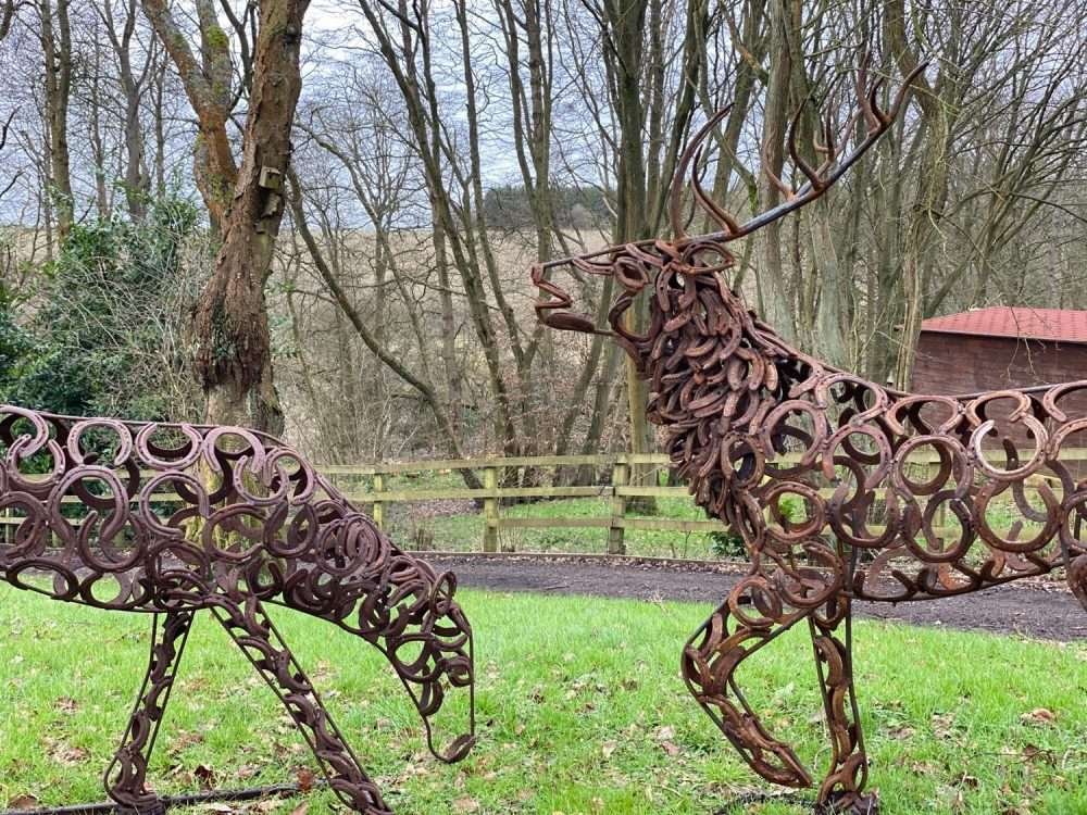 Stag and Doe Sculptures Together
