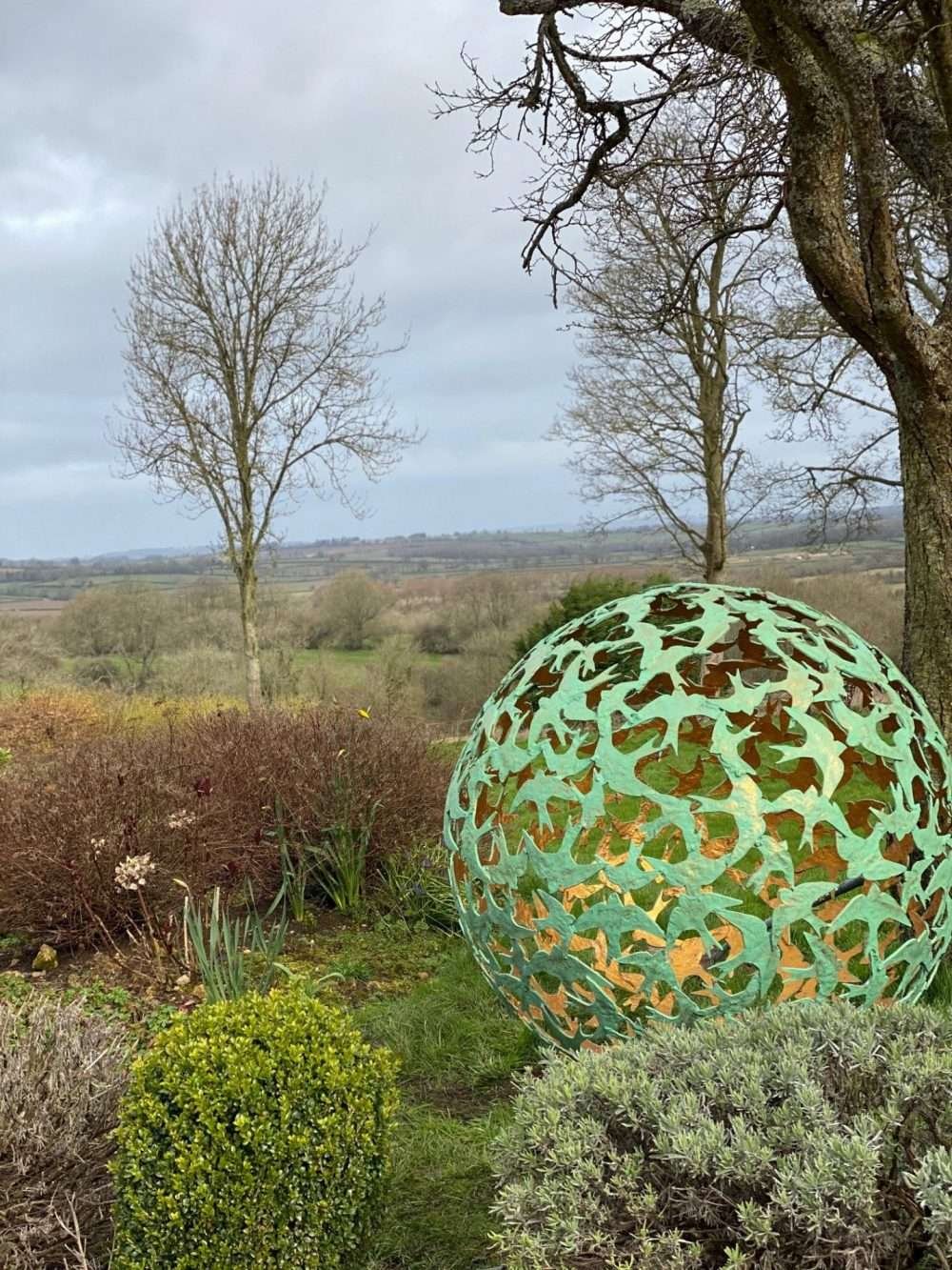 Swift Sphere Sculpture in wooded area