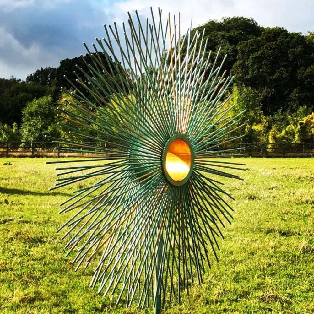 Verdigris Gold Peacock Sculpture In A Field