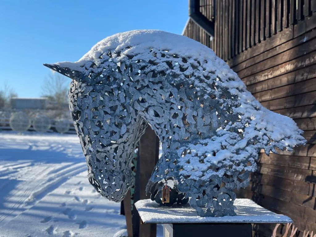 Horse Head Sculptures in the Snow