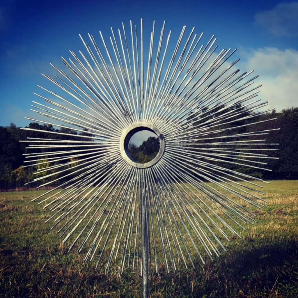 abstract sculpture in a field