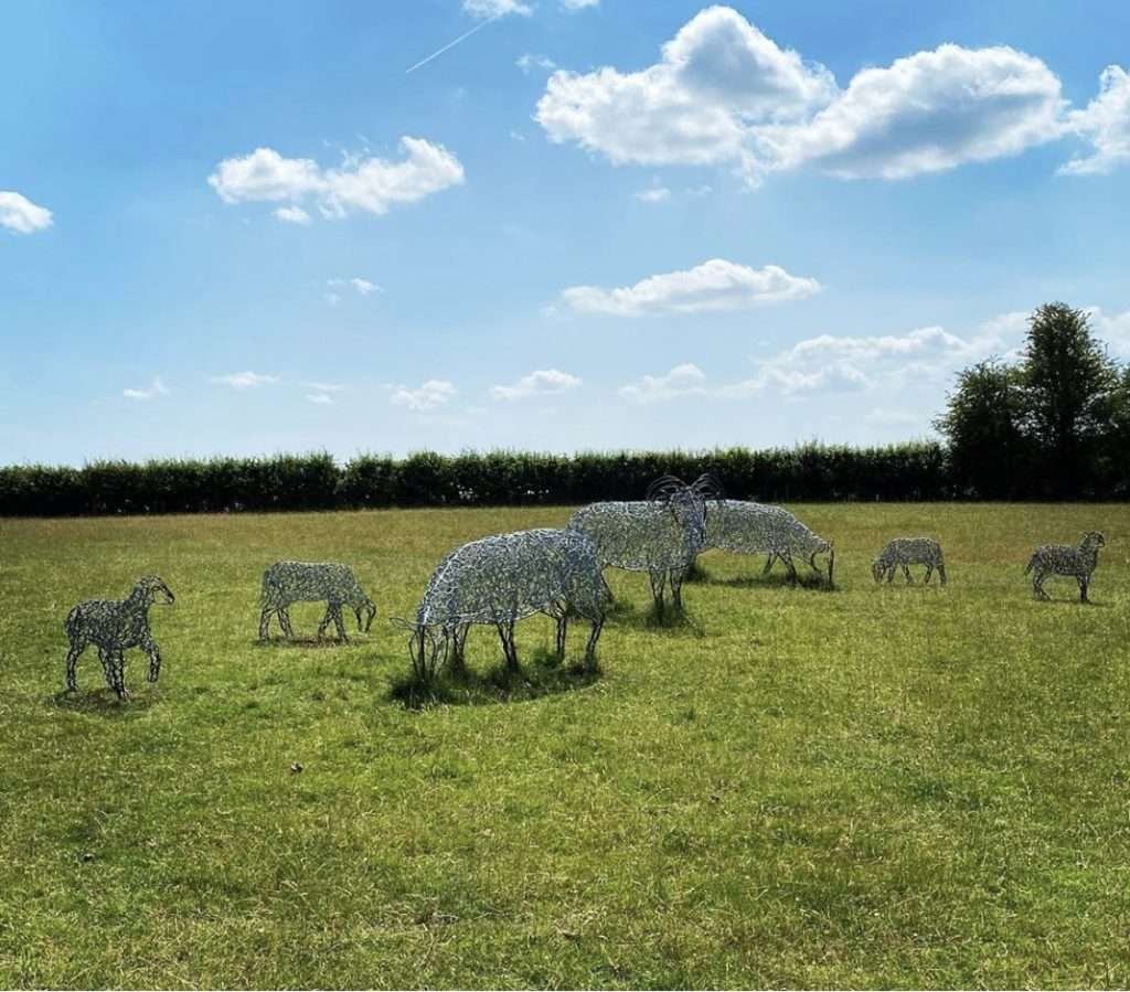 group of silver sheep sculptures