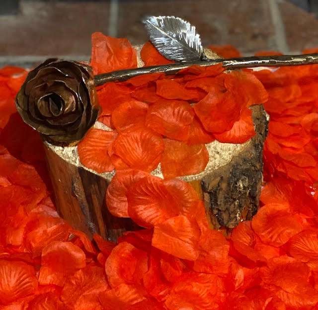Handmade Copper Rose on flower petals