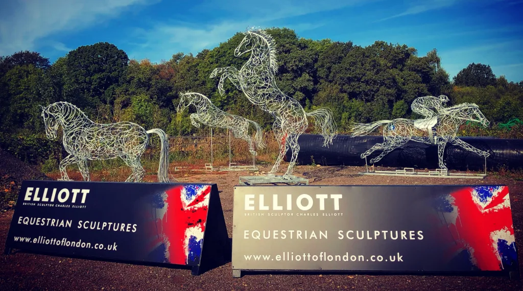 four horse sculptures in front of the elliott of london signs