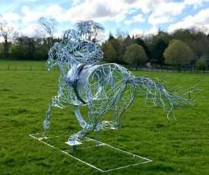 Horse and Jokey Sculpture In Wooded Area