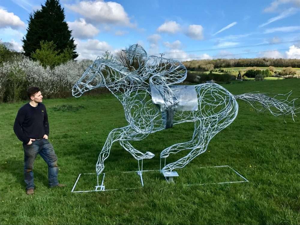 Man Looking At Horse and Jokey Sculpture