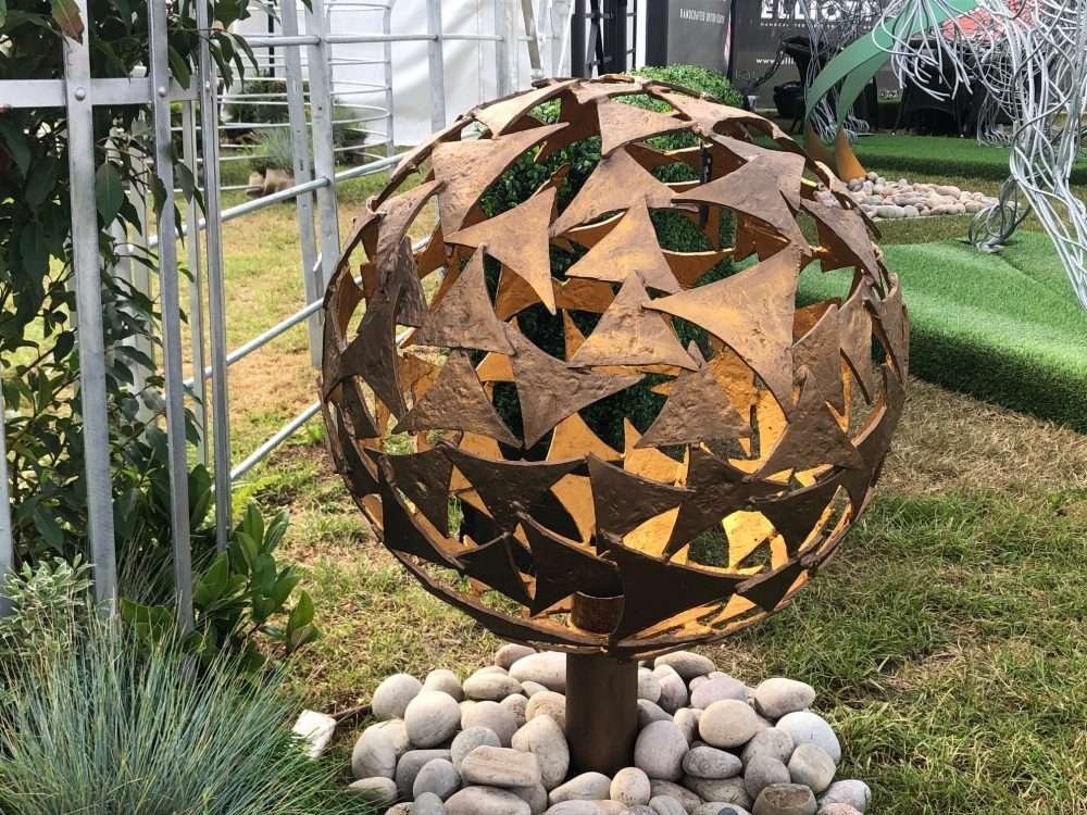 small bronze sphere in garden