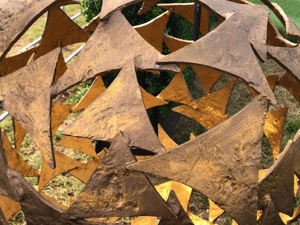 bronze and gold sphere close up