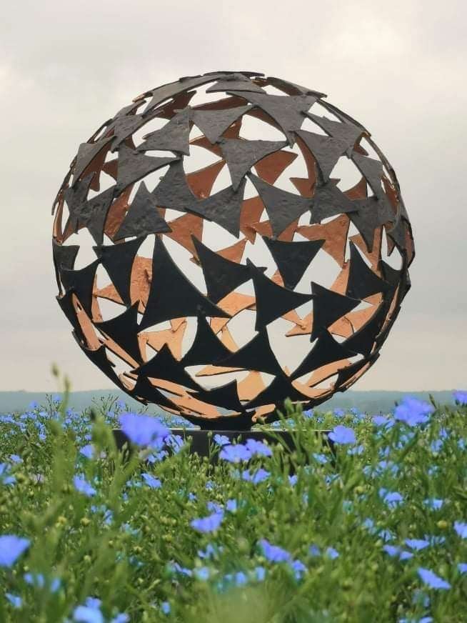 black and gold sail sphere sculpture