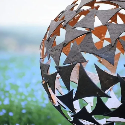 side view sphere sculpture in flowers