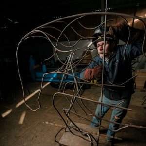 man making a sculpture