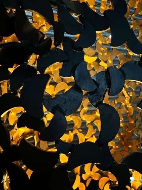 close up of black and gold horse head sculpture