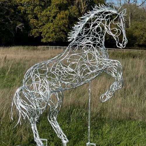 Two Side View Rearing Horse Sculptures